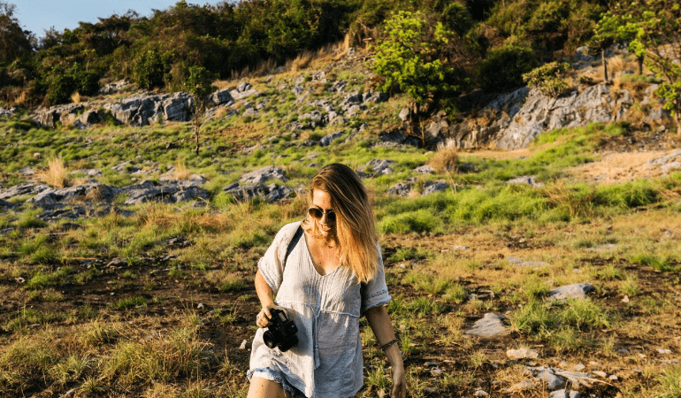 girl walking with camera